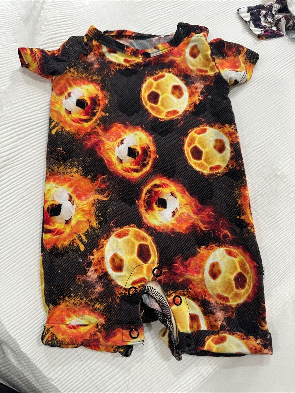 Black Kids Footie Romper with Fiery Soccer Ball Print